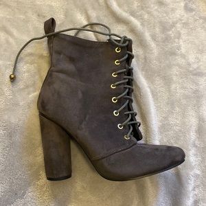 Heeled zip up boots.